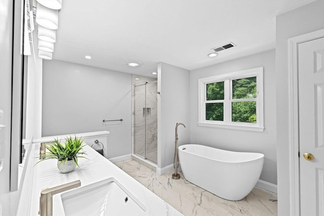 102 Saddleworth Way, Middleboro, MA 02346 - bathroom featuring marble tiled floors, a marble finish shower, a freestanding tub, and recessed lighting