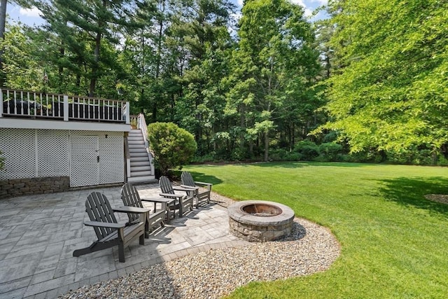 102 Saddleworth Way, Middleboro, MA 02346 - view of grassy yard featuring stairway, an outdoor fire pit, a patio area, and a wooden deck