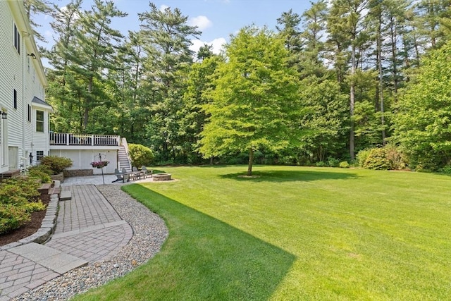 102 Saddleworth Way, Middleboro, MA 02346 - view of grassy yard featuring an outdoor fire pit, stairway, a patio area, and a deck