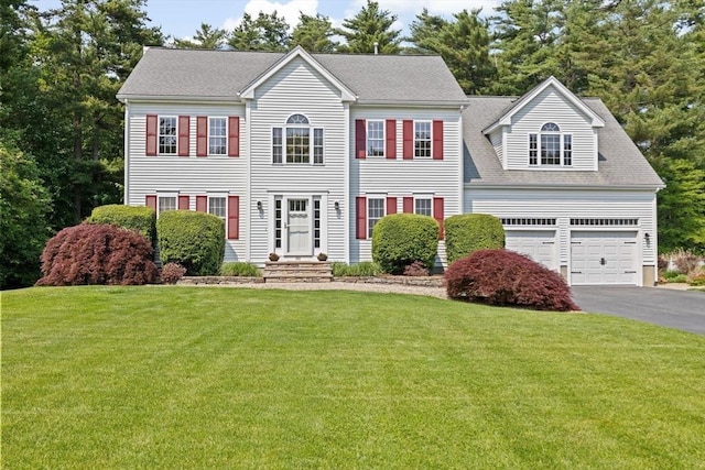 102 Saddleworth Way, Middleboro, MA 02346 - colonial house featuring driveway, a front yard, and roof with shingles