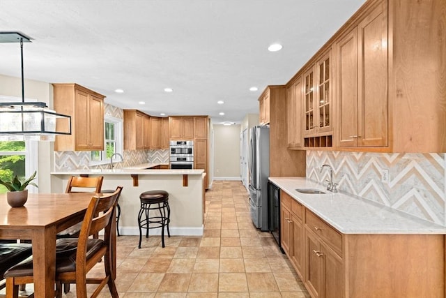 102 Saddleworth Way, Middleboro, MA 02346 - kitchen featuring stainless steel appliances, recessed lighting, light countertops, decorative backsplash, and glass insert cabinets