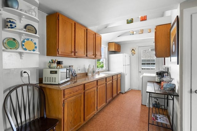 22 Wallace Pt, Bourne, MA 02532 - kitchen with white appliances, open shelves, light floors, and brown cabinetry