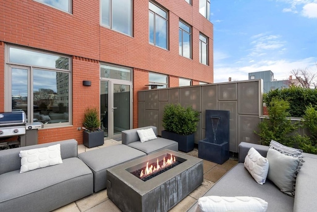 43 Westland Ave Unit 512, Boston, MA 02115 - view of patio / terrace with an outdoor living space with a fire pit