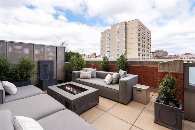 43 Westland Ave Unit 512, Boston, MA 02115 - view of patio / terrace with an outdoor living space with a fire pit and a view of city