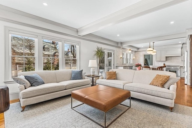 4 Norwood St, Winchester, MA 01890 - living area featuring wood finished floors, crown molding, recessed lighting, and beamed ceiling