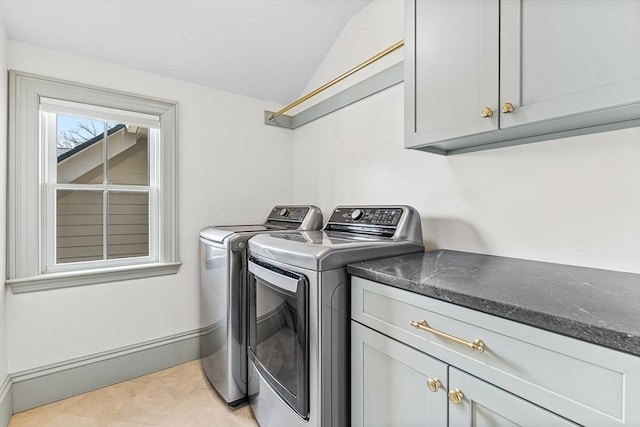 4 Norwood St, Winchester, MA 01890 - washroom with washer and clothes dryer, cabinet space, and light tile patterned flooring