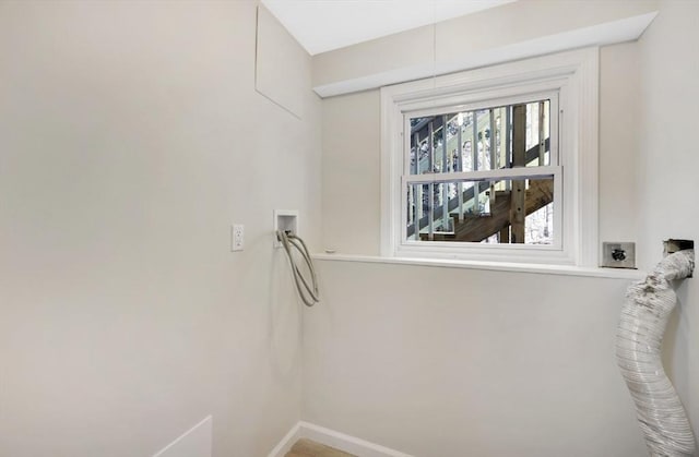 clothes washing area with washer hookup, laundry area, baseboards, and hookup for an electric dryer