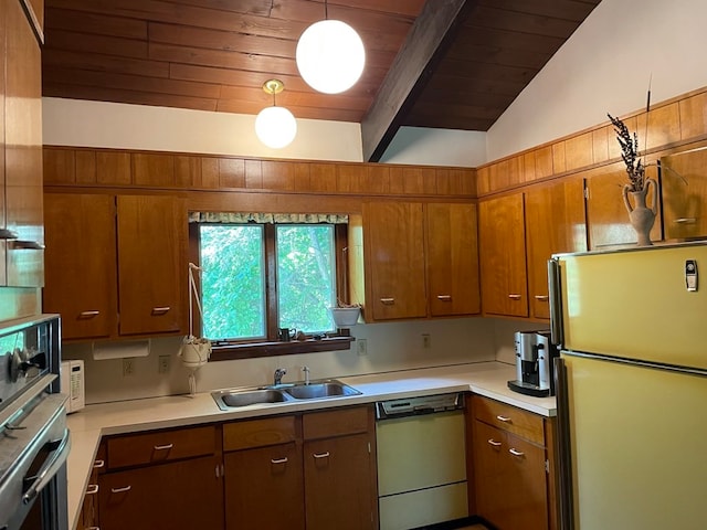 kitchen featuring sink, vaulted ceiling with beams, refrigerator, decorative light fixtures, and dishwashing machine