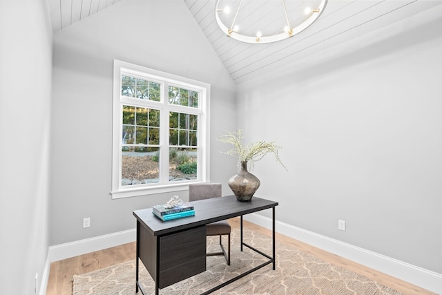 home office featuring an inviting chandelier, vaulted ceiling, wood ceiling, and light hardwood / wood-style floors