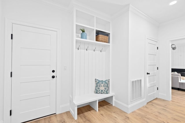 mudroom featuring crown molding and hardwood / wood-style floors