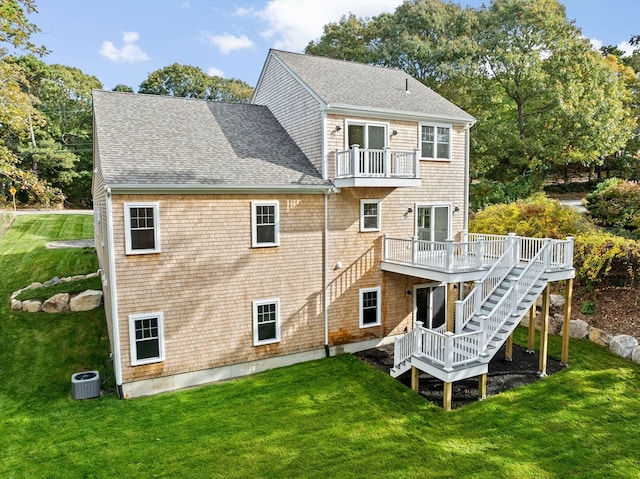 back of house featuring a yard, central air condition unit, and a deck