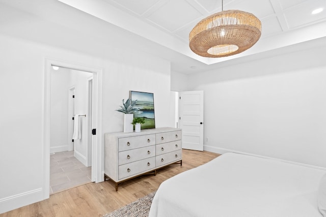 bedroom featuring coffered ceiling and light wood-type flooring