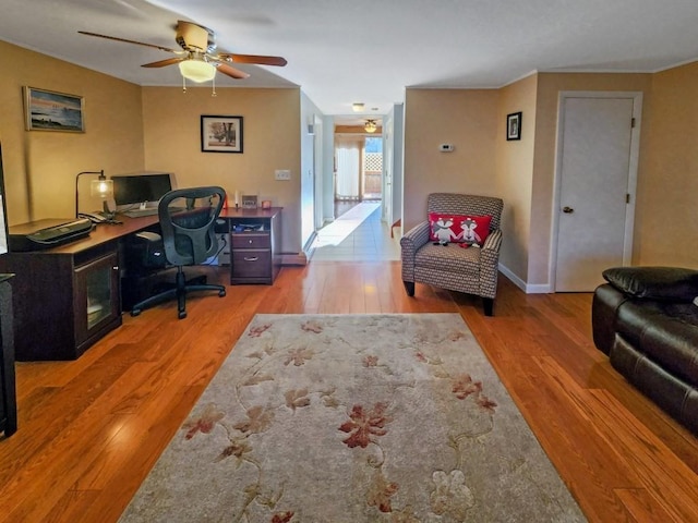 office featuring wood-type flooring and ceiling fan