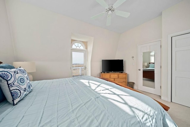 bedroom with ensuite bathroom, a ceiling fan, and carpet floors