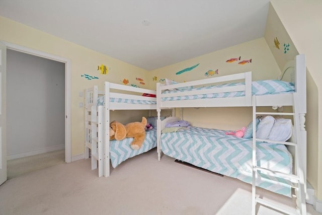 bedroom with baseboards and carpet floors