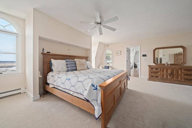 bedroom with light colored carpet, a ceiling fan, baseboards, and a baseboard radiator