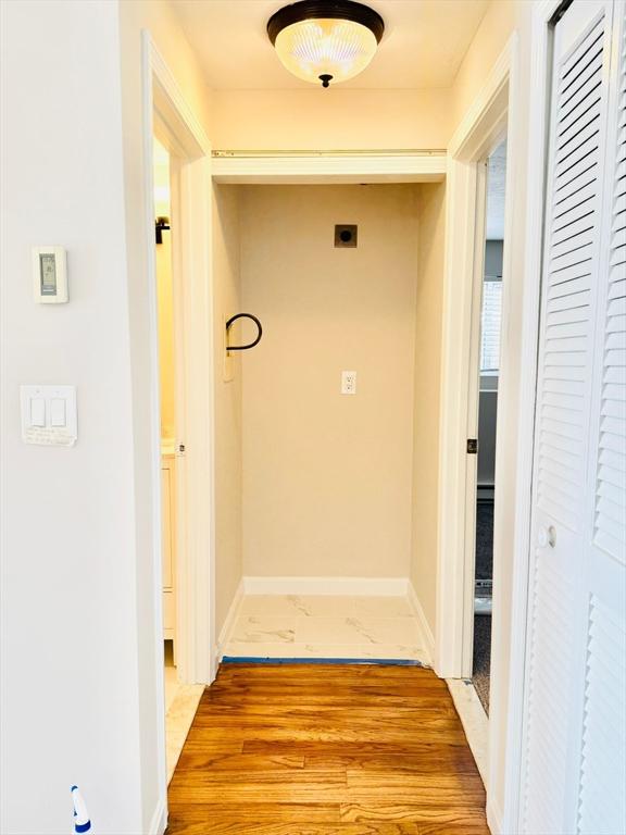 hall with light wood-type flooring