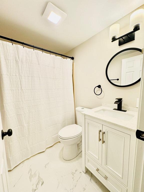 bathroom with vanity and toilet