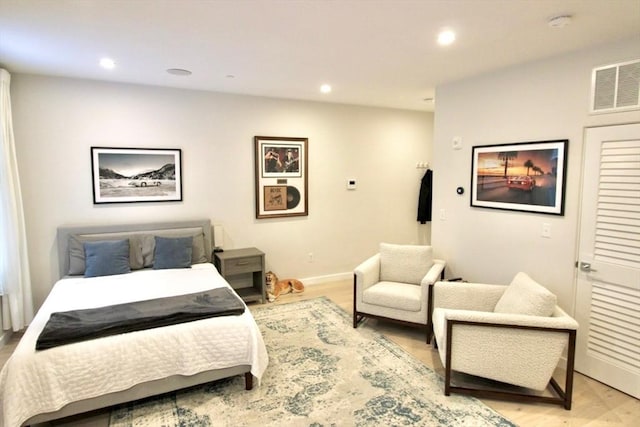 bedroom with light hardwood / wood-style floors