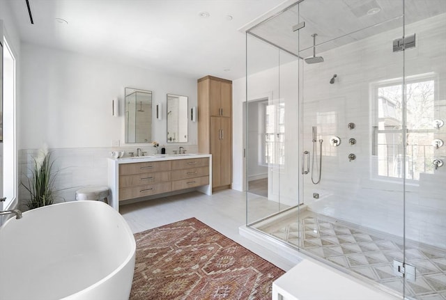 bathroom with vanity, plenty of natural light, and shower with separate bathtub