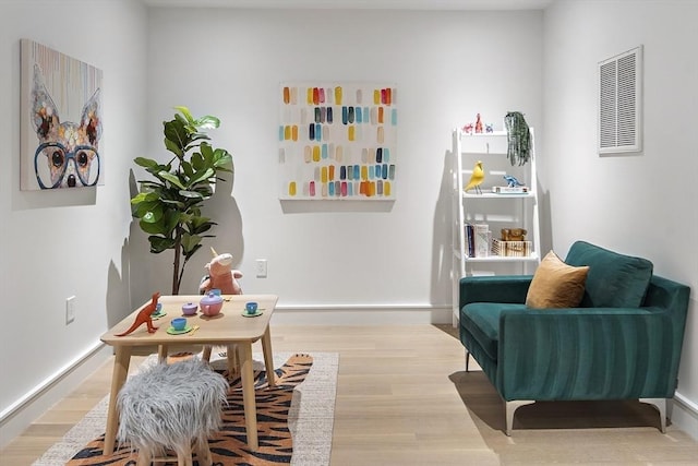 sitting room featuring light wood-type flooring