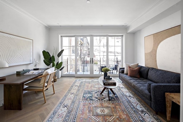 living room with light parquet flooring, ornamental molding, and french doors