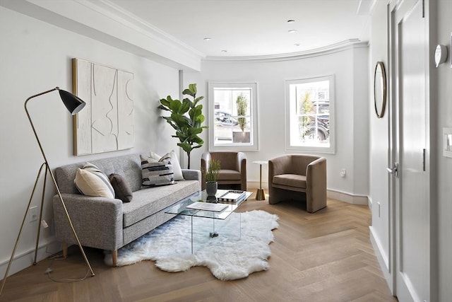 living area featuring crown molding and light parquet floors