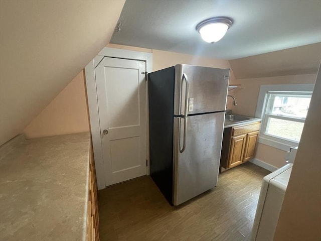 3 Camden St, South Hadley, MA 01075 - kitchen featuring a sink, light countertops, freestanding refrigerator, wood finished floors, and vaulted ceiling
