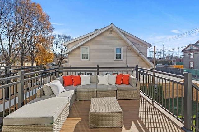 wooden terrace with outdoor lounge area