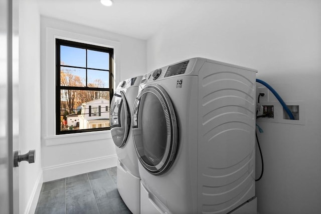 laundry area with independent washer and dryer