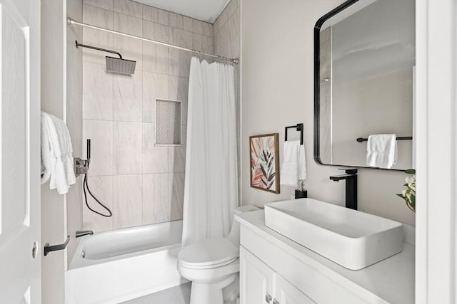 bathroom featuring vanity, toilet, and shower / bath combo with shower curtain