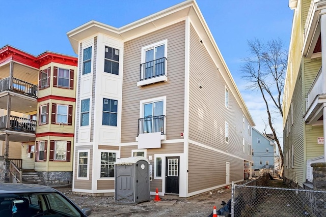 view of front of house with fence