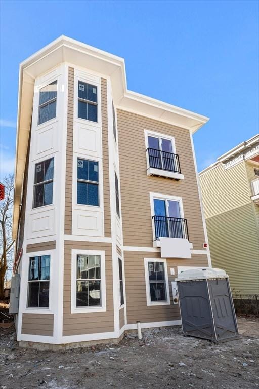 rear view of house with a balcony