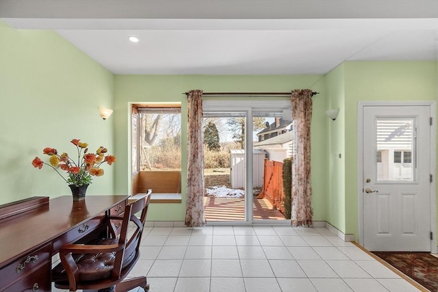 doorway to outside featuring recessed lighting, light tile patterned flooring, and baseboards