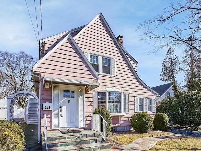 view of front facade featuring a chimney