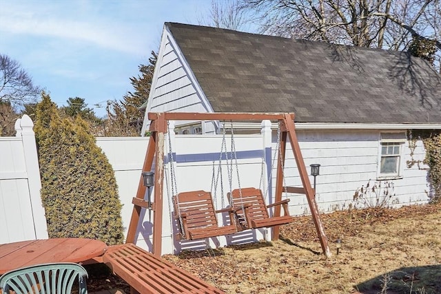 view of outdoor structure featuring fence