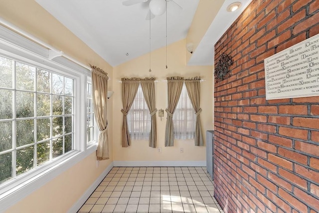 interior space featuring lofted ceiling and ceiling fan