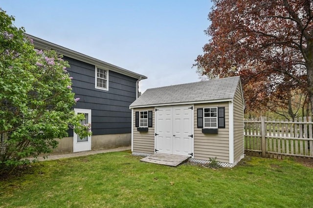 view of shed with fence