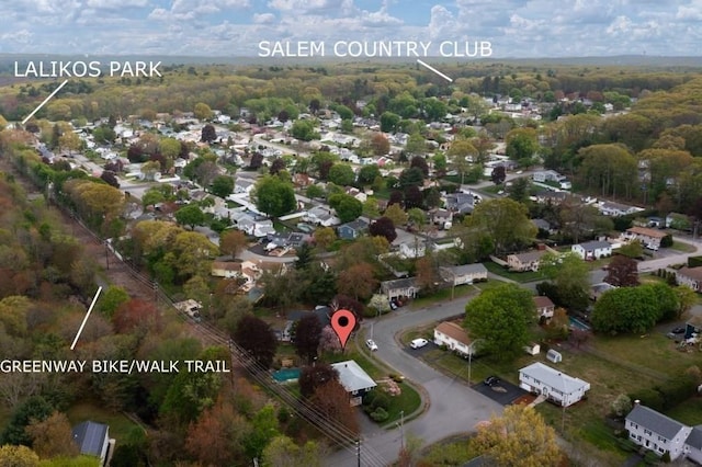 birds eye view of property featuring a forest view and a residential view