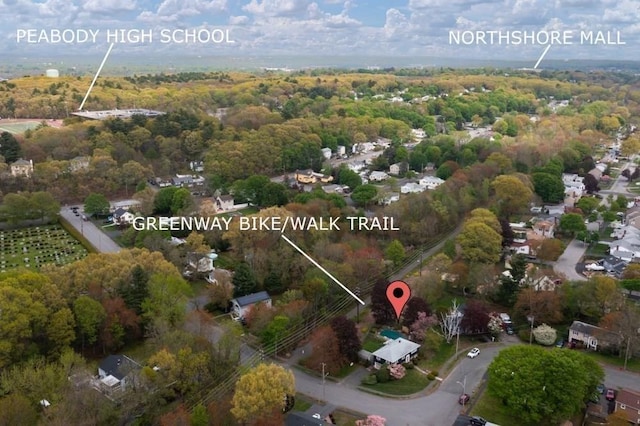 drone / aerial view with a wooded view