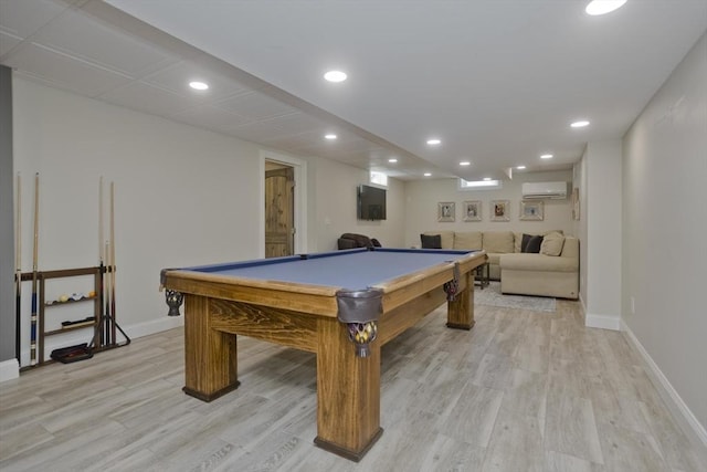 rec room with light wood finished floors, pool table, baseboards, a wall unit AC, and recessed lighting