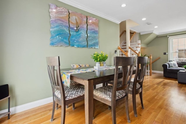 224 Grove St Unit 2, Waltham, MA 02453 - dining room with crown molding, light wood-style flooring, stairs, and recessed lighting