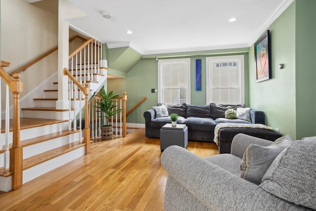 224 Grove St Unit 2, Waltham, MA 02453 - living area with ornamental molding, wood finished floors, stairs, and recessed lighting