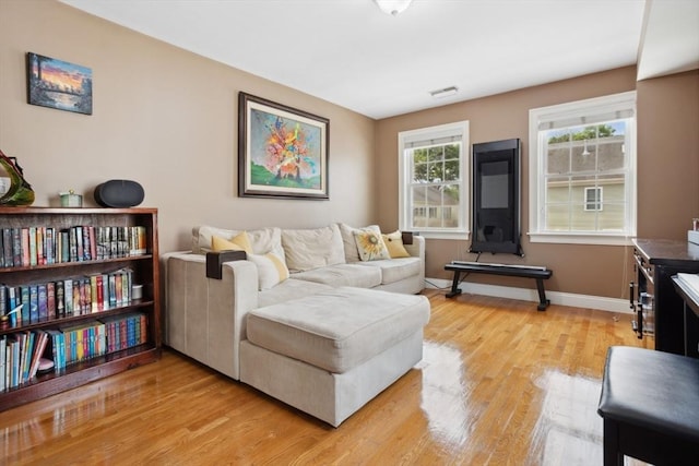 224 Grove St Unit 2, Waltham, MA 02453 - living room featuring light wood-type flooring and baseboards