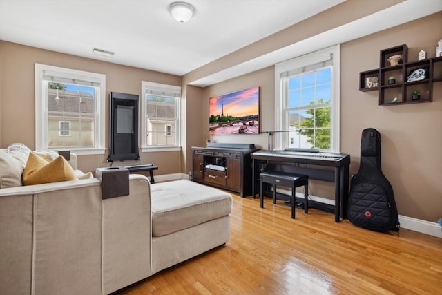 224 Grove St Unit 2, Waltham, MA 02453 - living area featuring light wood-style flooring and baseboards
