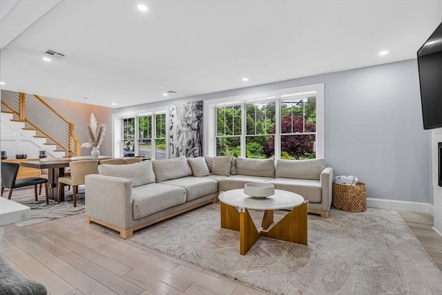 34 Cedar St, Hopkinton, MA 01748 - living area featuring stairs, recessed lighting, light wood finished floors, and plenty of natural light