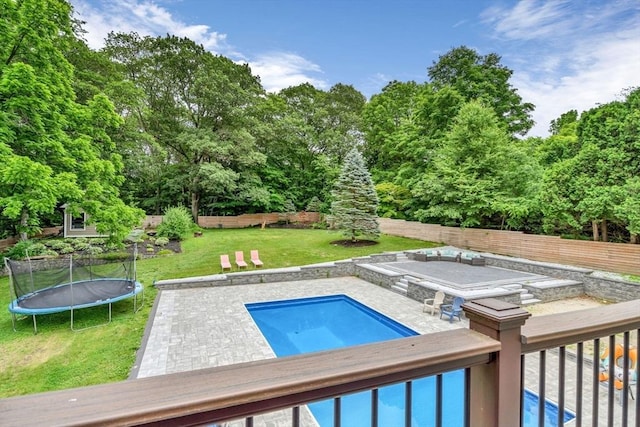 34 Cedar St, Hopkinton, MA 01748 - swimming pool featuring a trampoline, a fenced backyard, and view of scattered trees