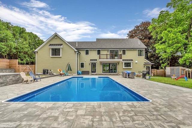 34 Cedar St, Hopkinton, MA 01748 - back of house with a balcony, a patio area, and a fenced backyard