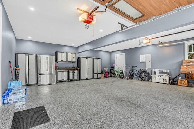 34 Cedar St, Hopkinton, MA 01748 - garage featuring freestanding refrigerator, a garage door opener, and recessed lighting