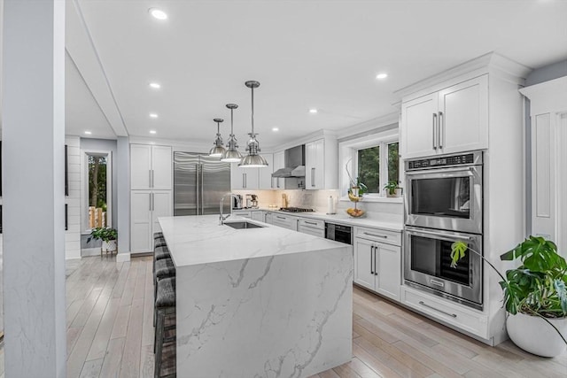 34 Cedar St, Hopkinton, MA 01748 - kitchen with stainless steel appliances, wall chimney range hood, white cabinetry, recessed lighting, and tasteful backsplash
